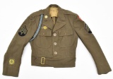 WWII U.S. Army Service Force Jacket with assorted patches and shoulder cord.