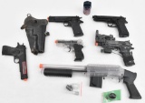 Grouping of air soft 6mm toy firearms and pellets working condition unknown.
