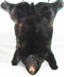 Black bear rug with felt backing and full skull