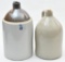 Two stoneware jugs. 3 gallon brown top and 2 gallon.
