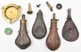(3) Copper powder flasks, leather shot bag and a U.S.S. North Carolina brass ashtray.