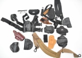 Grouping of assorted holsters, slings and eye glasses.