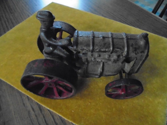 VINTAGE CAST IRON TOY TRACTOR WITH MAN-75% ORIGINAL PAINTED SURFACE