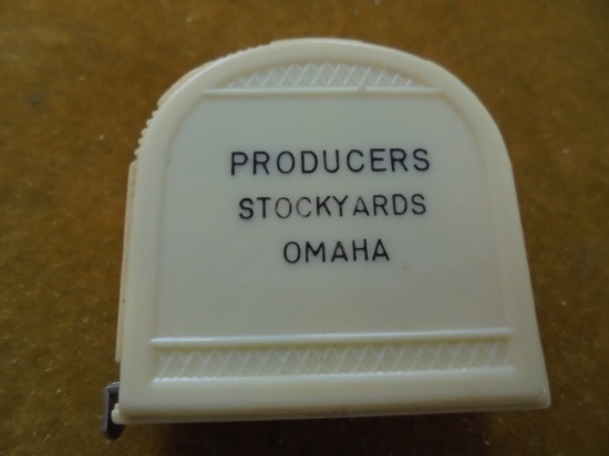OLD HARD PLASTIC POCKET TAPE MEASURE WITH "PRODUCERS STOCKYARDS-OMAHA"