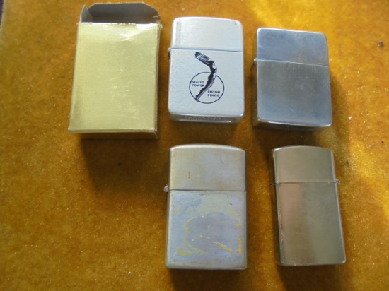 4 OLD CIGARETTE LIGHTERS FOR ONE LOT--ONE IS ADVERTISING "SEALED POWER PISTON RINGS"