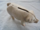 NEWER CAST IRON PIG COIN BANK--4 1/2 INCHES LONG