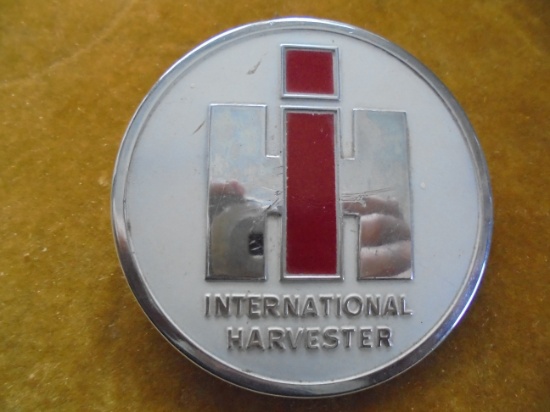 VINTAGE "INTERNATIONAL" LOGO EMBLEM FROM A TRACTOR--3 INCHES ACROSS-GOOD BACK MOUNTS