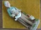 OLDER LADY FIGURINE WITH CHICKEN-SEE MARK IN PHOTO'S