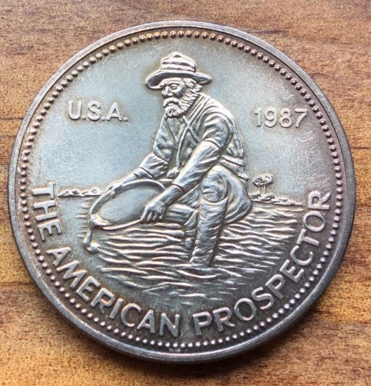 1987 THE AMERICAN PROSPECTOR - ONE OUNCE .999 FINE SILVER COIN