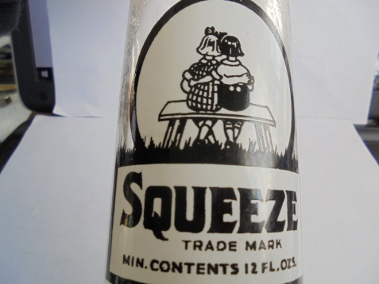 OLD "SQUEEZE" SODA BOTTLE WITH NEAT GRAPHICS