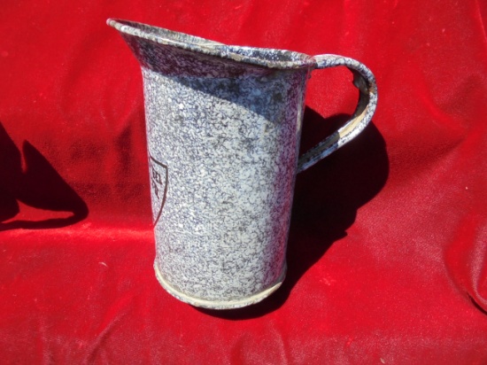 ONE PINT ENAMEL PITCHER WITH FRONT CREST ON IT-DIFFERENT AND NICE CONDITION