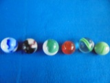 GROUP OF (6) INCH OR SO MARBLES-SOME NIBBLES