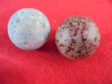 THIS IS A LOT OF (2) LARGE MARBLES (1 1/4 INCHES)-ONE HAS RED FLAKES