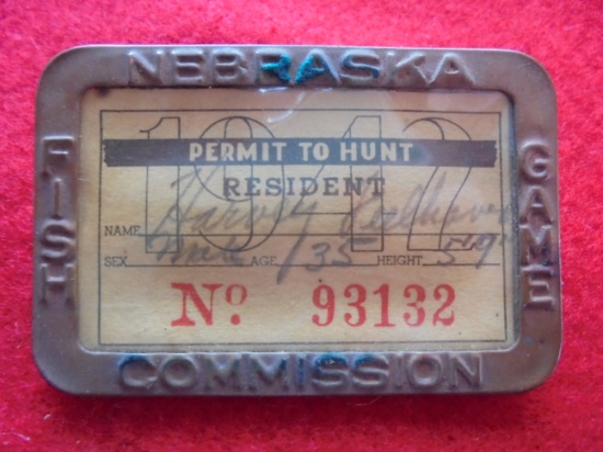 1942 NEBRASKA HUNTING LICENSE IN A BRASS PINBACK FRAME FROM "NEBRASKA FISH/HUNT COMMISSION"