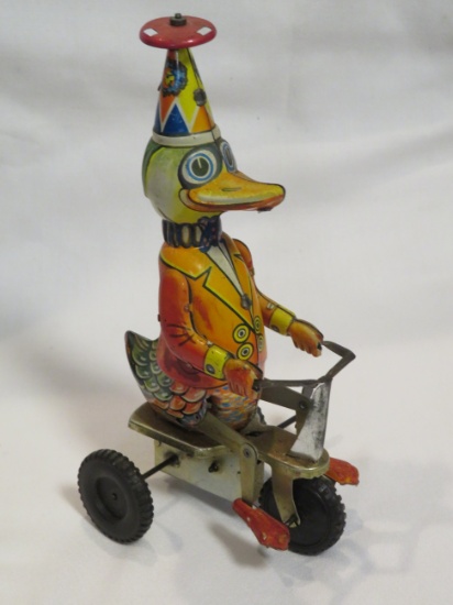 WIND-UP BIRD ON TRICYCLE