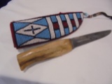 LEATHER KNIFE SHEATH WITH BLUE-WHITE-RED AND BLACK BEADS--ANTLER KNIFE COME WITH