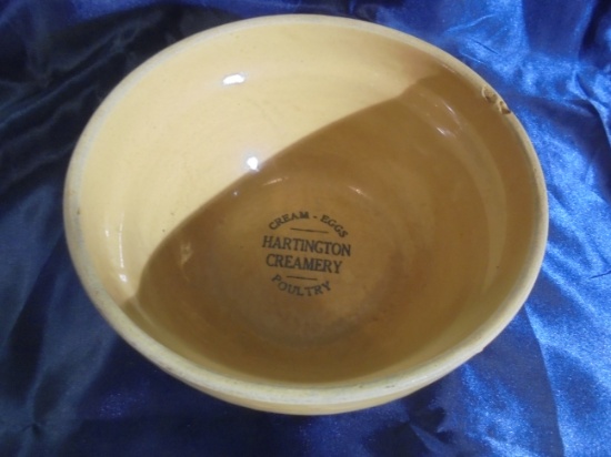 OLD 9 INCH POTTERY BOWL WITH ADVERTISING FROM "HARTINGTON CREAMERY"
