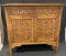 ANTIQUE WOODEN BUFFET WITH CARVED DESIGNS