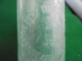 EARLY EMBOSSED GLASS BOTTLE 