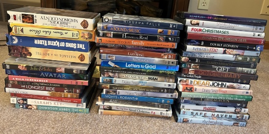 LARGE LOT OF DVDS AND A FEW VCR TAPES