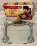 SUNBEAM KING SIZE HEATING PAD AND A BATHROOM SCALE