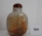 Antique Chinese Carved Jadeite Snuff Bottle With White & Rustic Brown Figural Scenes