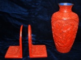 Asian cinnabar lot of a  9 in. Vase & a pair of book ends 5.5 in.