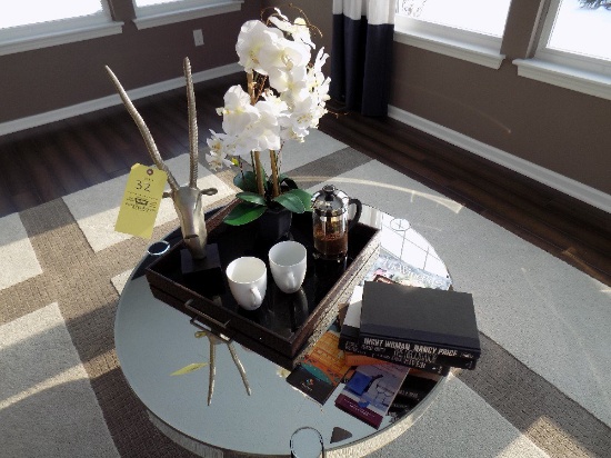 Artificial plant, tray with mugs, and books