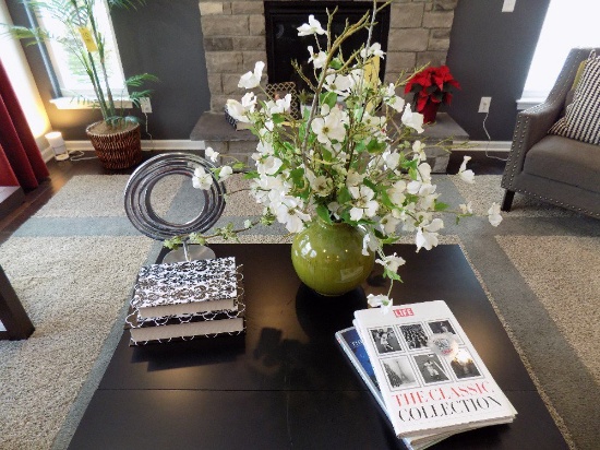 Vase of flowers, metal hoop decor, and storage boxes