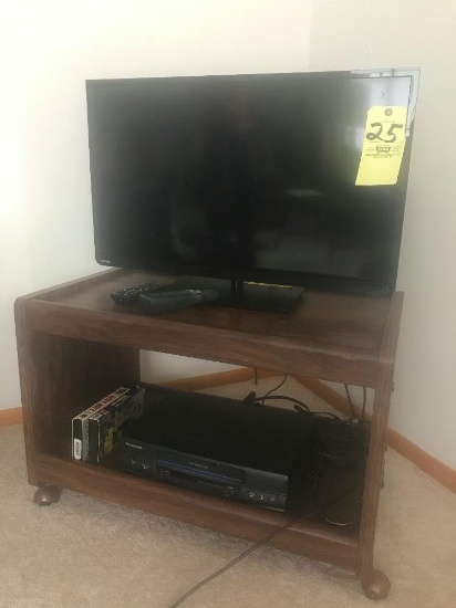 Toshiba 32" flat-screen TV - VHS player and stand