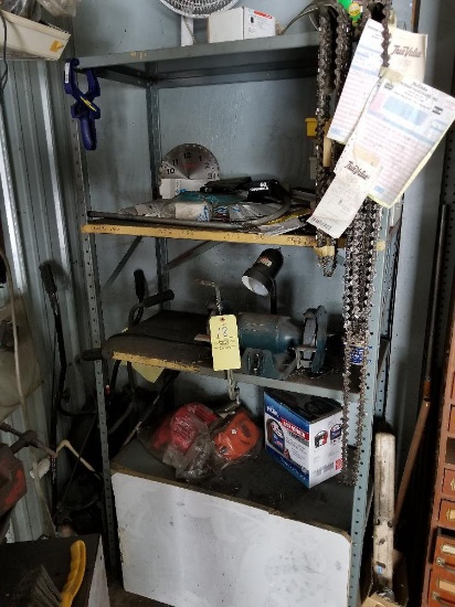 Shelf and contents including bench grinder, chainsaw chains