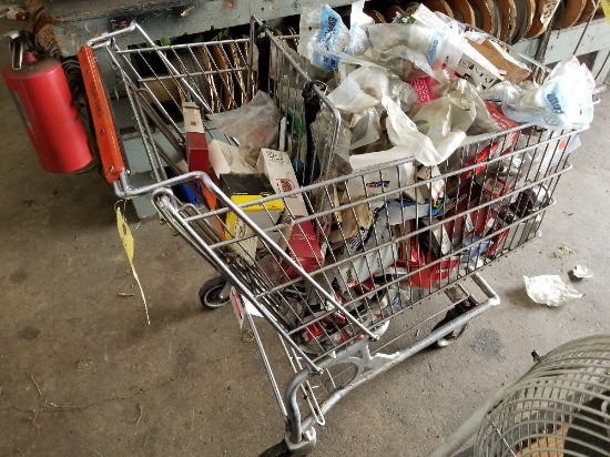 Shopping cart full of small engine parts