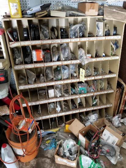 Organizer bin with small engine parts and weed whip parts