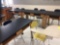 12 tables, 20 chairs, file cabinet, seven student desk/chairs