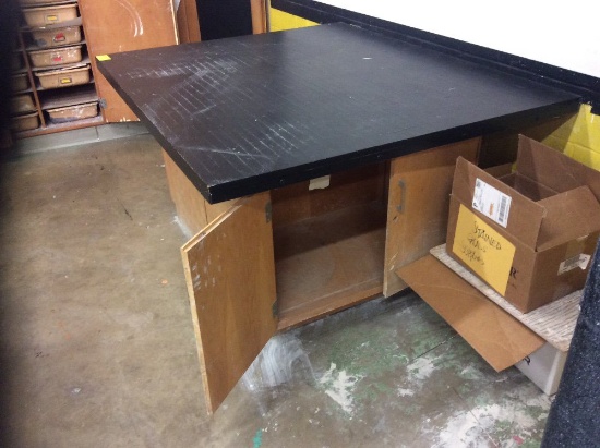 Two wood top work tables and three wooden cabinets. Contents not included