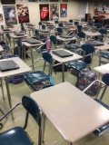 33 student desks. Contents not included