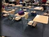 29 student desks. Contents are not included