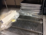 12  cake pans, cake extenders and 6 grates