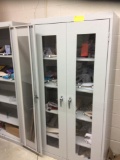 Three metal storage cabinets, contents are not included