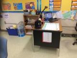 Teachers desk, bookcase, side table, two file cabinets, overhead screen. Contents are not included