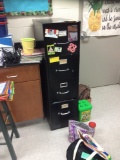 File, teachers desk, student desks, table, bookshelf, workbench