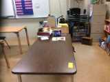 Testing desk, two student desks, three tables, teachers desk. Contents not included
