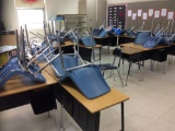 32 desks and 32 chairs.