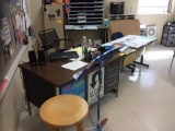 Teachers desk, two tables, two files, one chair. Contents are not included