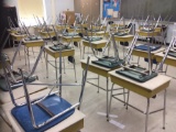 31 desks and 31 chairs.