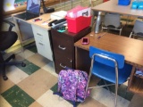 Two teachers desks, two small desks, two file cabinets, bookshelf. Contents are not included