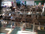 28 student desks and 28 student chairs. Contents not included