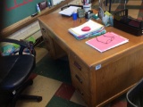 Teachers desk, chair, bookshelf. Contents are not included