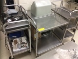 Four stainless steel rolling carts. Contents not included