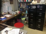 Three file cabinets, middle shelf, table, two bookshelves,